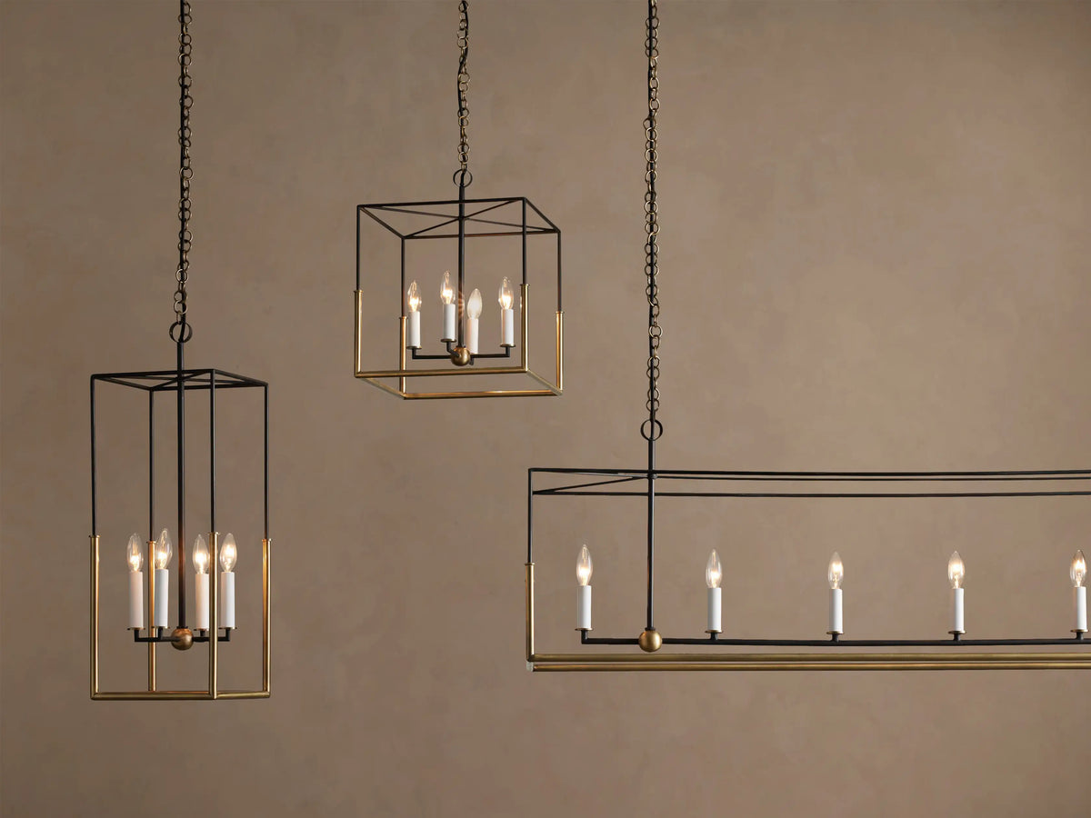 Holt Linear Chandelier's antiqued brass linear ceiling mount with two brass chains descending, one with a black cord.