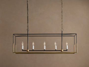 Holt Linear Chandelier: black rectangular frame with antiqued brass accents, 5 unlit candle bulbs, suspended by chains.