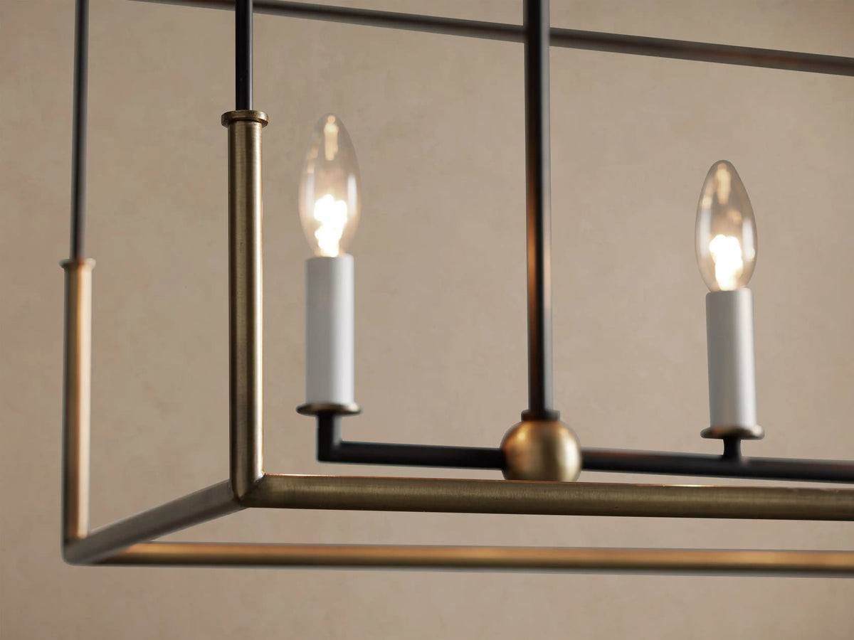 Holt Linear Chandelier: Rectangular black iron frame with antiqued brass base, hanging by chains, showcasing five candelabra bulbs.
