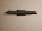 Zaeden Picture Light: Bronze-plated iron horizontal bar light mounted on a neutral wall, highlighting its metallic finish.