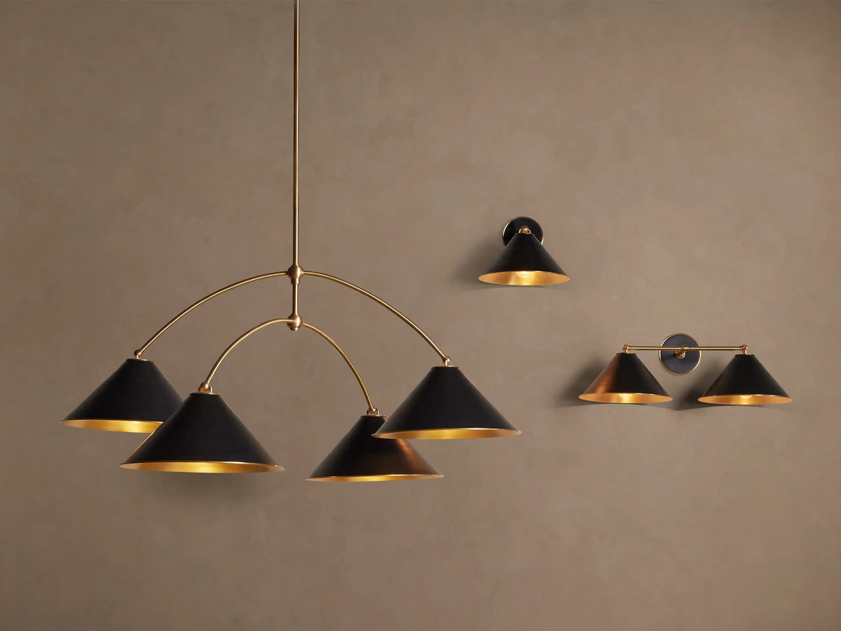 Arno Round Chandelier with three matte black conical shades, polished brass interiors, and curved brass arms.