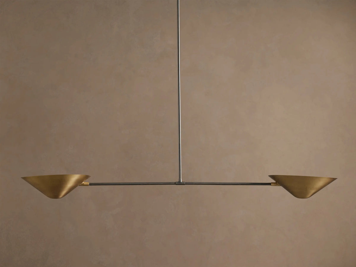 Simms Linear Chandelier: Dark, antiqued brass conical canopy and slender extension rod against a textured beige ceiling.