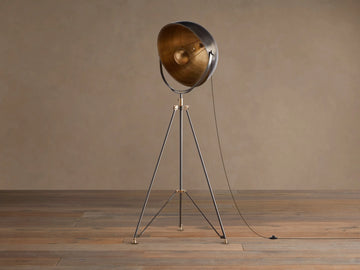 Retro Tripod Floor Lamp with oil-rubbed bronze tripod base & antique brass accents. Round shade has dark exterior, golden interior.
