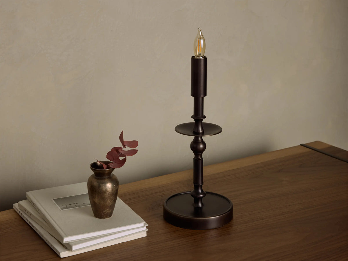 Close-up of the bronze Winslow Candlestick Table Lamp, showing the round base and candlestick-style stem.