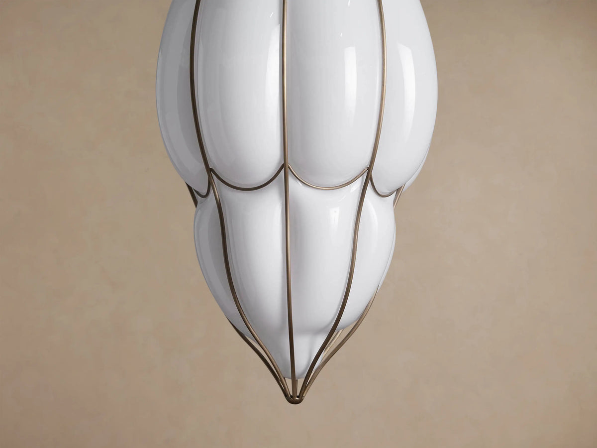 Close-up of Margolis Large Pendant with a white opaque glass shade and a brass-finished iron frame.