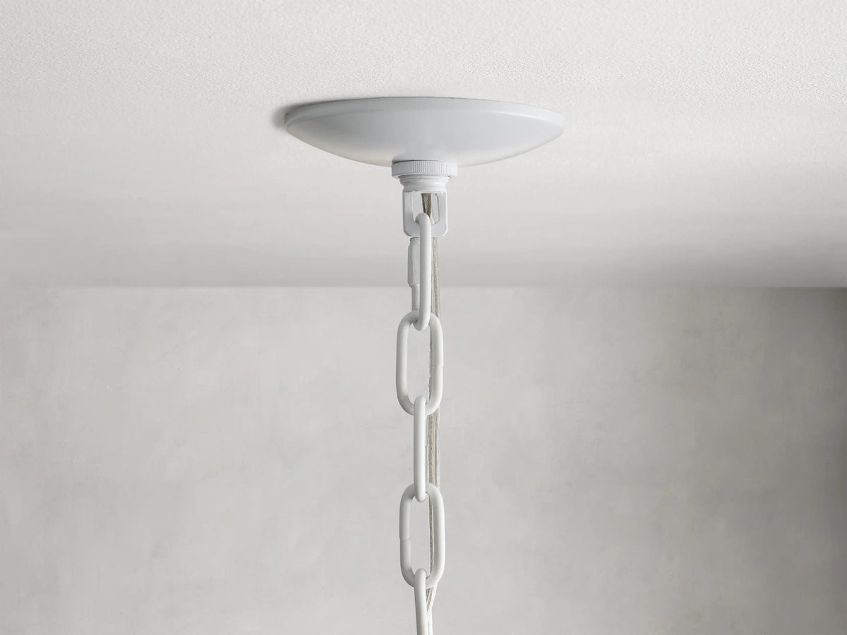 Paloma Chandelier with layered, handwoven rattan shade in a warm white color, showing intricate texture and soft curves.