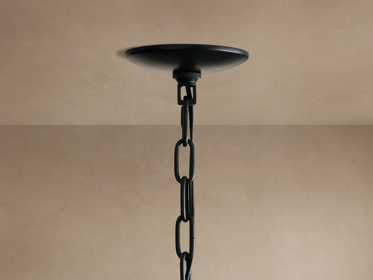 Paloma Chandelier: Close-up of its dark grey, layered handwoven rattan shade, intricate texture visible.