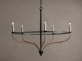 Black iron Rosalind chandelier with five illuminated candle-like bulbs. Curved arms are wrapped in natural rattan.