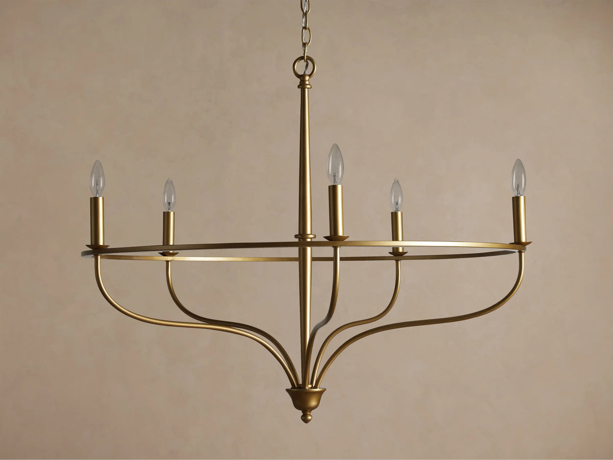 Brass Rosalind Chandelier with five lit candle-style bulbs on a thin circular frame, hanging against a neutral background.