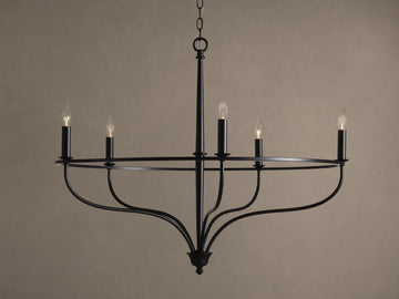 Rosalind Chandelier, matte black, with five lit candelabra bulbs on a circular frame, suspended by a chain.