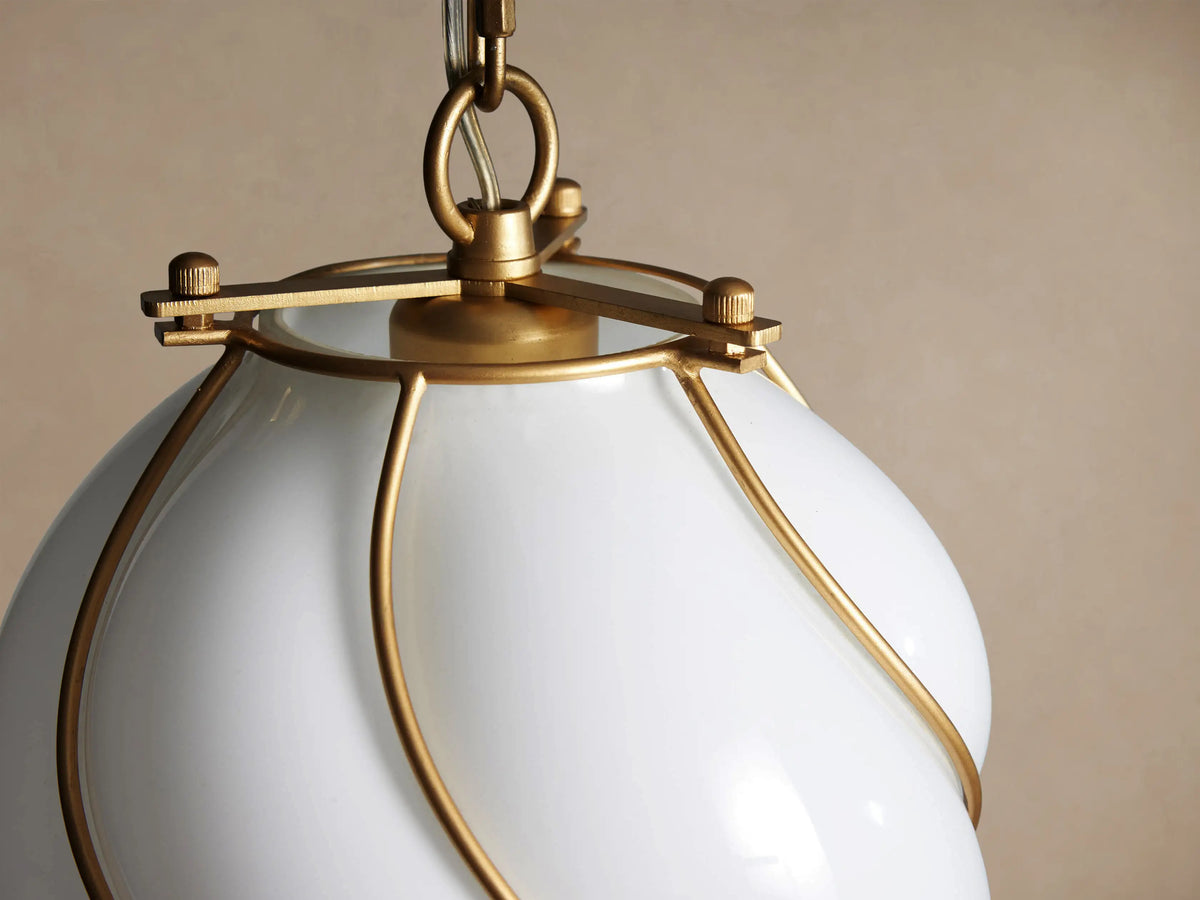 Margolis Small Pendant: White hand-blown glass with a twisted, bulbous form, wrapped in a brass spiral frame, hanging from a chain.