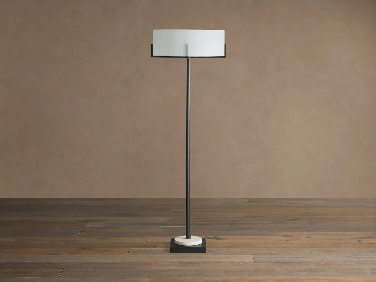 Frederic Floor Lamp: slender, dark bronze pole, white linen shade, cream marble on black square base.