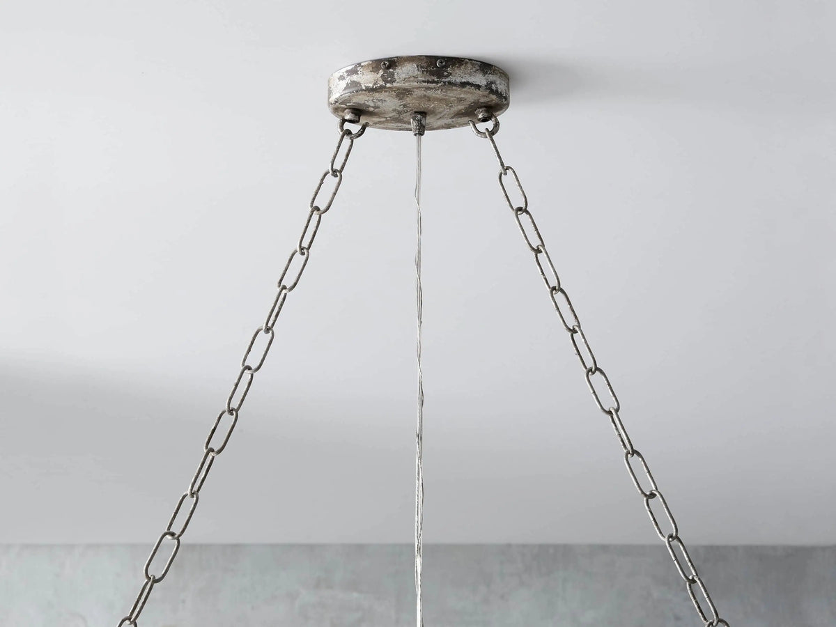 Aubrey Rectangular Chandelier in silver with hanging Italian glass crystals, suspended from ceiling, minimalist design.