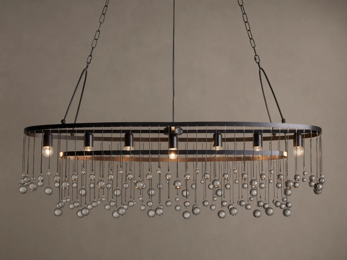 Aubrey Oval Chandelier: Dark iron oval frame with exposed bulbs & numerous hanging clear glass beads.