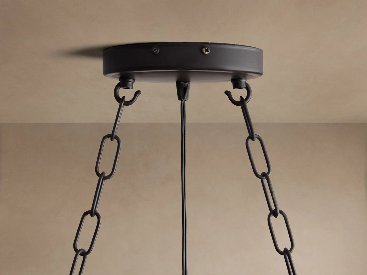 Aubrey Oval Chandelier: Dark iron oval frame, exposed warm bulbs, and many smoky gray glass spheres with bubble texture.