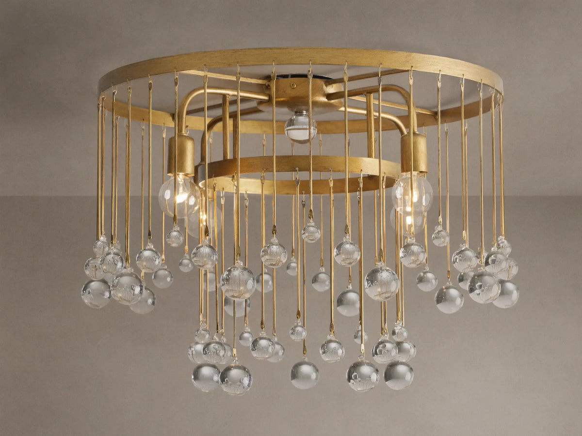 Aubrey Flush Mount light fixture, gold iron frame, dangling clear glass spheres, and visible bulbs, mounted on a ceiling.