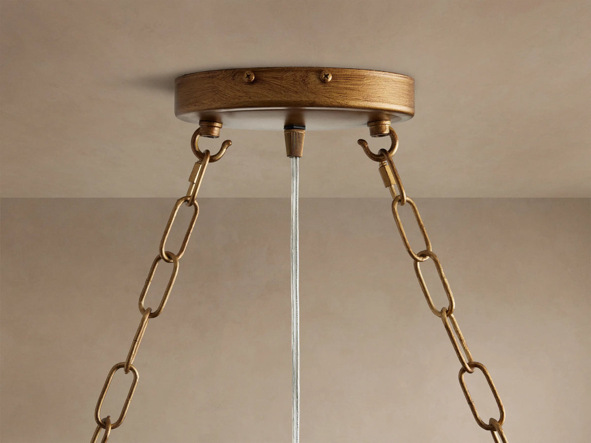 Aubrey Rectangular Chandelier: golden-bronze metal frame, clear glass balls dangling, exposed Edison bulbs.