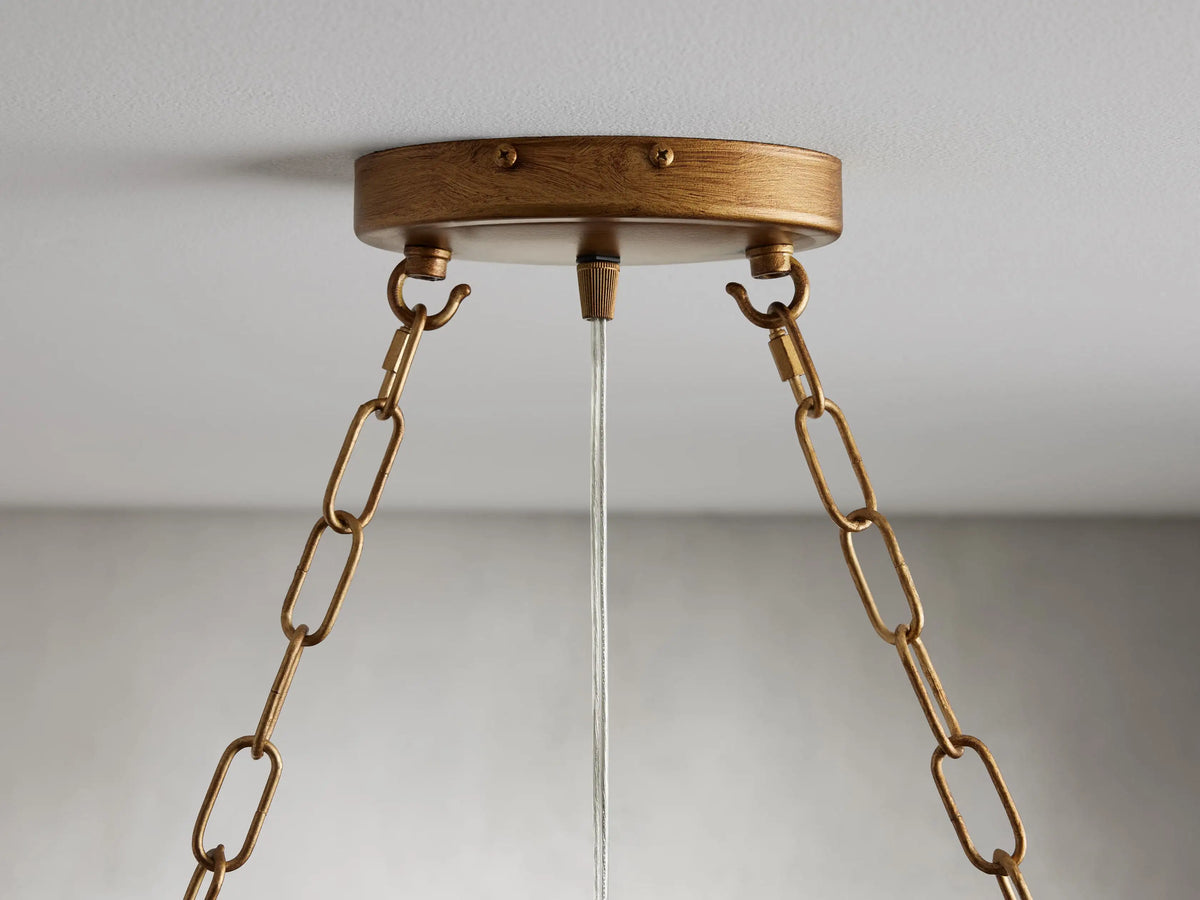 Oval chandelier made of solid iron with a gold finish, featuring hanging glass spheres on slim rods, creating an elegant look.