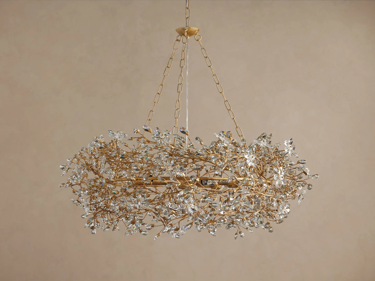 Luxurious gold-toned Fiore Crown Chandelier with a circular, branch-like frame adorned with sparkling clear crystal blossoms.