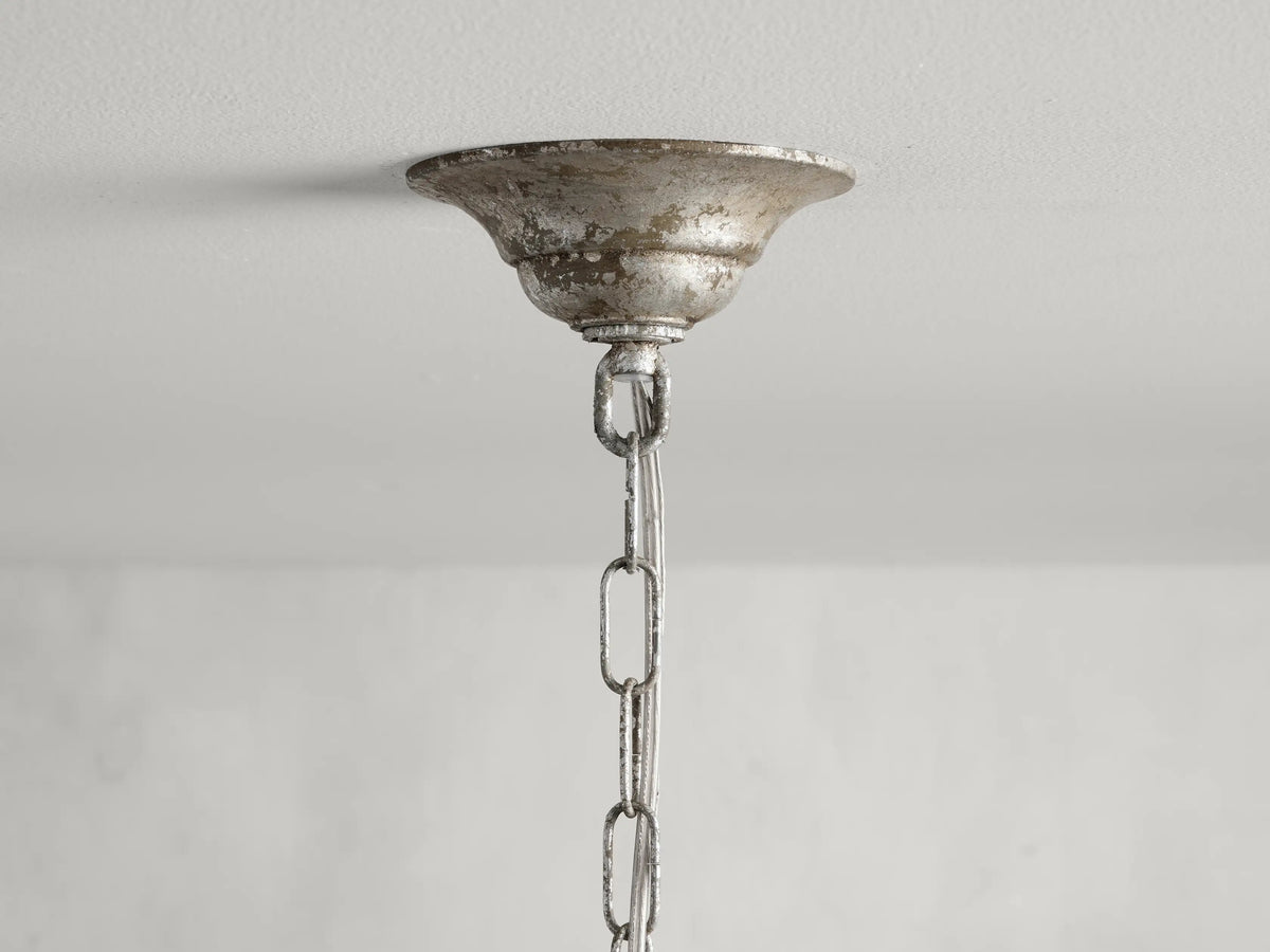Viticcio Pendant with hand-molded iron branches in silver finish and hanging faceted glass crystals, featuring bulb sockets beneath leaf-like structures.