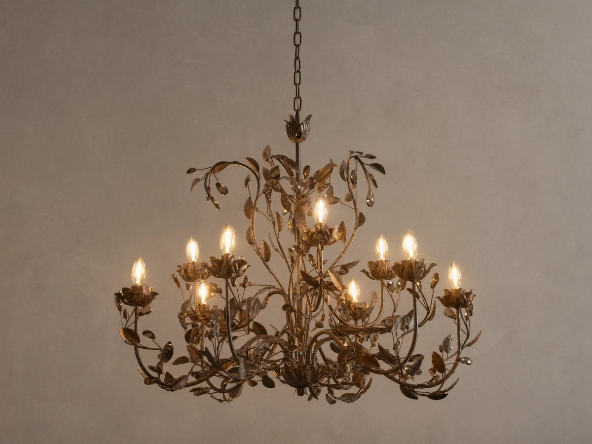 Nicoletta Round Chandelier, bronze metal with intricate leafy vines, 8 glowing candelabra bulbs, and dark crystal accents.