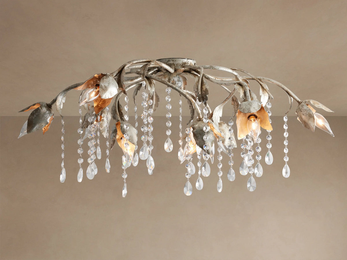 Viticcio Flush Mount with artistic silver-finished iron branches and leaves, illuminating bulbs, and sparkling crystal strands.