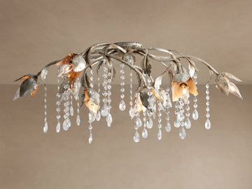 Viticcio Flush Mount with artistic silver-finished iron branches and leaves, illuminating bulbs, and sparkling crystal strands.