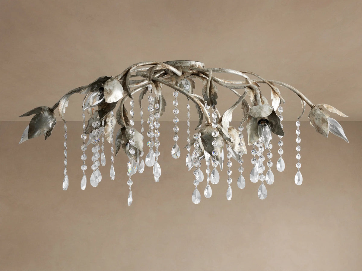 Viticcio Flush Mount with artistic silver-finished iron branches and leaves, illuminating bulbs, and sparkling crystal strands.