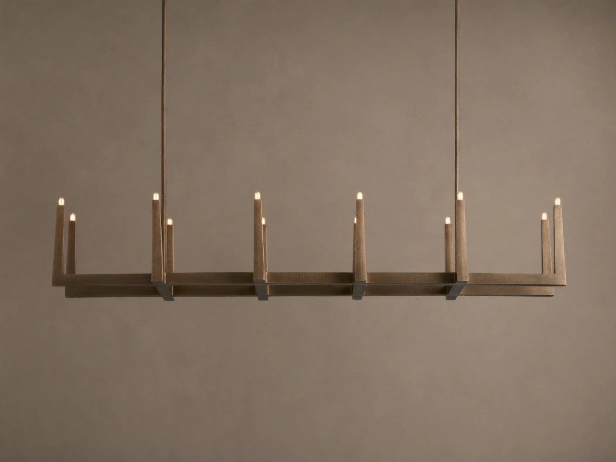 Emmet Linear Chandelier in antiqued brass, hanging horizontally. Rectangular frame features 10 lit, candelabra-style bulbs.