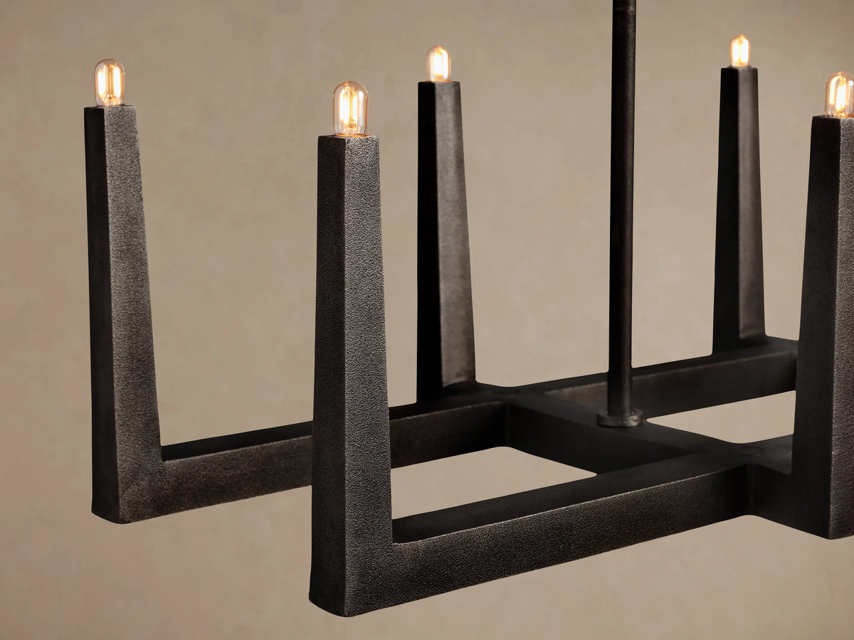 Emmet Linear Chandelier, dark textured antiqued brass/bronze, rectangular frame with 8 upward-facing candle-style lights.
