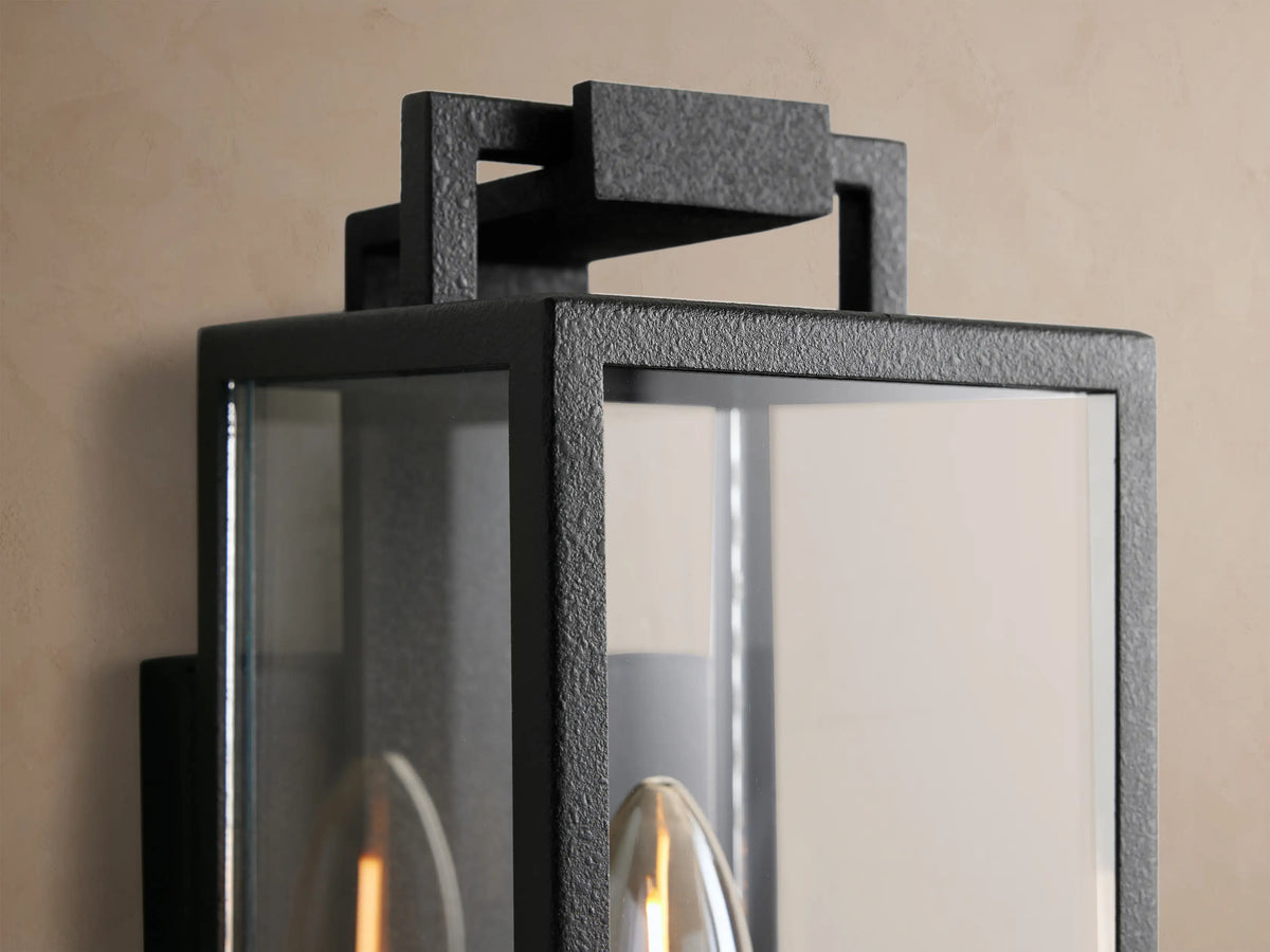 Hendricks Outdoor Sconce: Black iron & clear glass rectangular lantern, single candle-style bulb, mounted vertically.